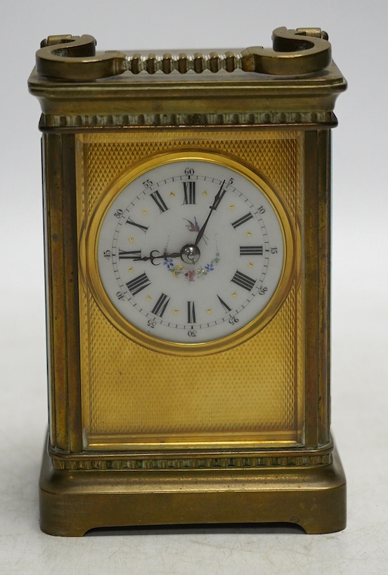 A brass cased carriage timepiece with enamel dial, with key, 15cm high. Condition - good, not tested